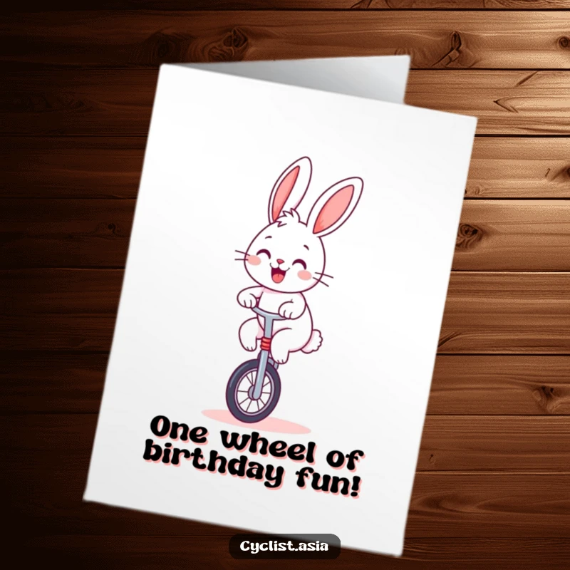 Funny Free Printable Birthday Card: A cheerful bunny smiles while expertly balancing on a unicycle, celebrating a birthday.