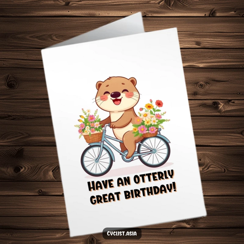 Free Printable Birthday Card: A happy otter cycling with a basket overflowing with colorful flowers, spreading joy.