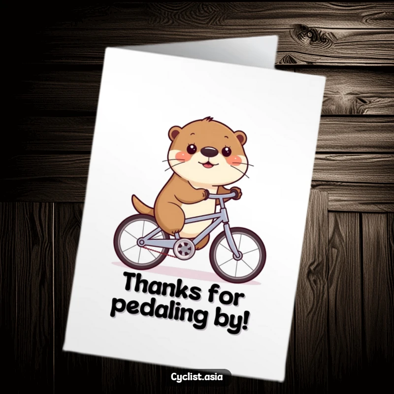 Funny Free Printable Thank You Card: Otter wobbling on a bike, nose wiggling, expressing thanks joyfully.