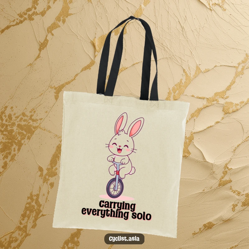 Funny bunny tote bag, cheerful creature balancing on a unicycle, humorous and practical tote bag.