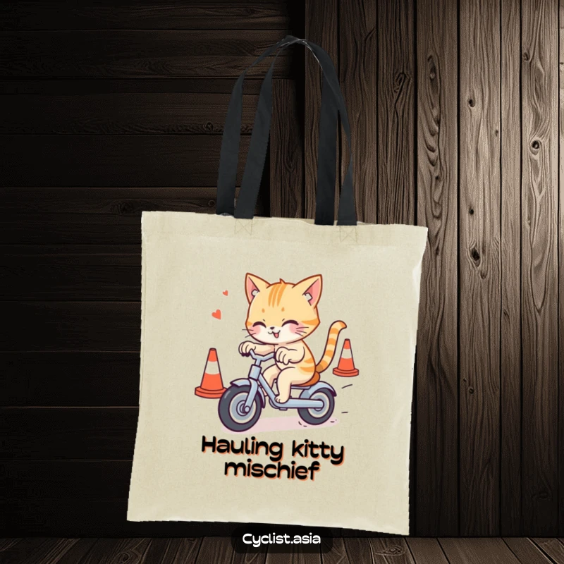 Funny cat tote bag showing a mischievous cat navigating traffic cones on a tricycle, ideal for carrying essentials with humor.
